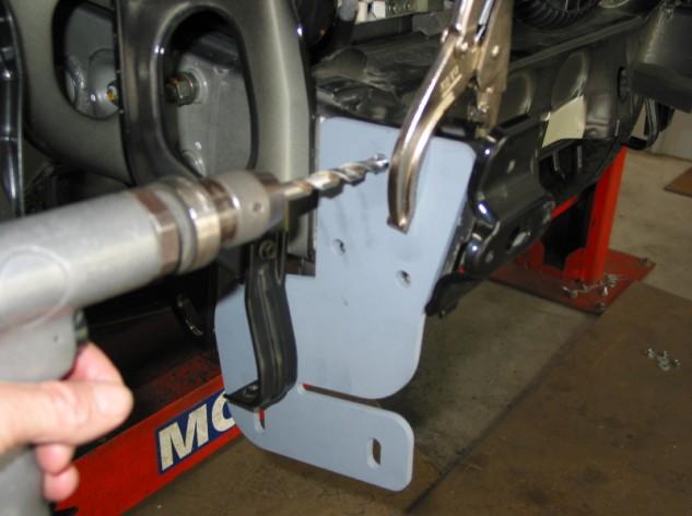 Align protection bar with vehicle. Position as high as possible on steel mounting plates for maximum ground clearance.