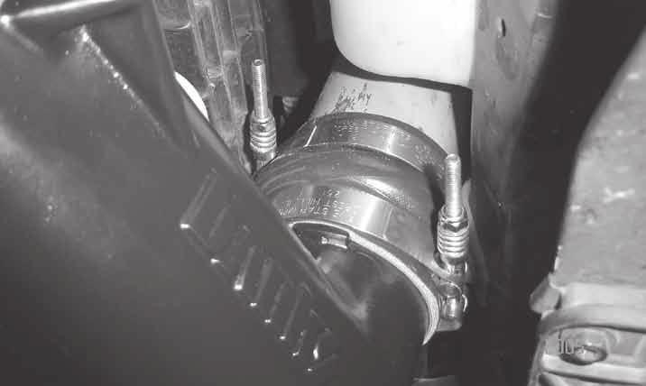 Figure 7. Orientation of the Hose Clamps on the Driver Side. 35. Completely remove the stock gaskets from both sides of the heater block and intake manifold.