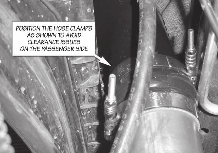 31. Tighten the upper radiator mounting bolts and torque to 8 ft-lbs (96 in-lbs). 32. Install the passenger side boost tube. The passenger side uses a 2.