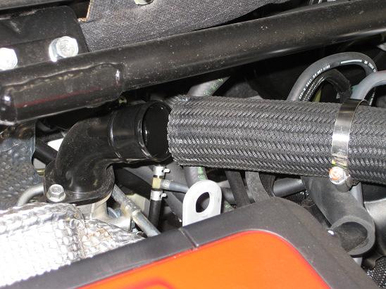 remove the OE air box assembly 15 Loosen the 10mm bolt that holds the turbo side of the upper IC