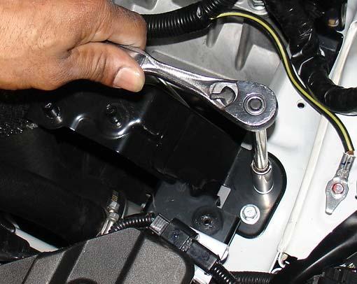 Loosen the clamp on the lower intercooler hose.
