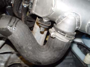 It is a tight area, so have some patience. Figure 11 Step 12: Once the passenger side intercooler is in place, install the dowel bracket as shown in Figure 12.