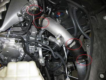 23. Remove the driver side air temperature sensor and its harness on the OE Throttle body pipe. 24.