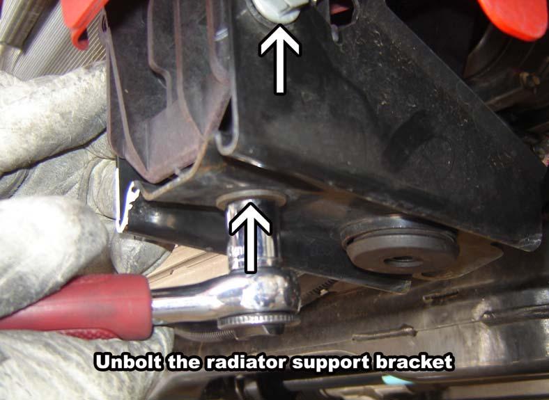 Unbolt the radiator support bracket from the driver