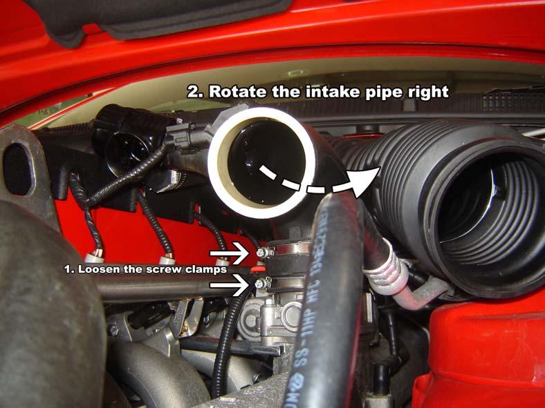 Loosen the two screw clamps at the bottom of the intake pipe and rotate approximately 10 degrees to the right. Fasten securely after pipe work is installed. Install an HDi 2.