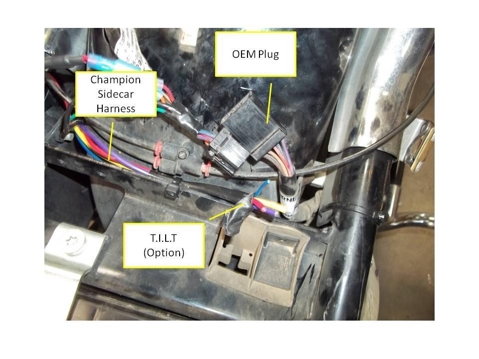 Figure 11 c. Connect the Champion plugs to the OEM male and female plugs. Attach the positive terminal wire to the battery. The OEM plug is indicated below. 5.2 T.I.L.T. Option a. Remove gas tank. b. Attach the tilt switch bracket near the clutch lever as shown in Figure 2.