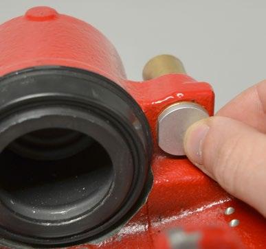 This illustration shows the bushing as it would appear while being installed into the caliper.