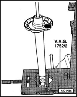 Page 12 of 18 42-32 - Align lower spring base and spring retainer in direction of shock absorber eye, as