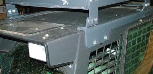 Remove two plugs from each side of cab near the top and towards the front.