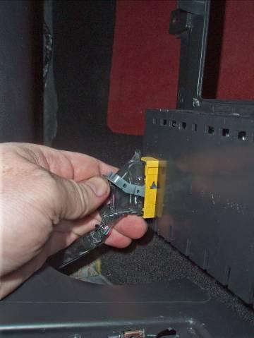 (Figure 7) STEP 9: Carefully remove the connector located at the bottom of the radio trim plate on the passenger side.