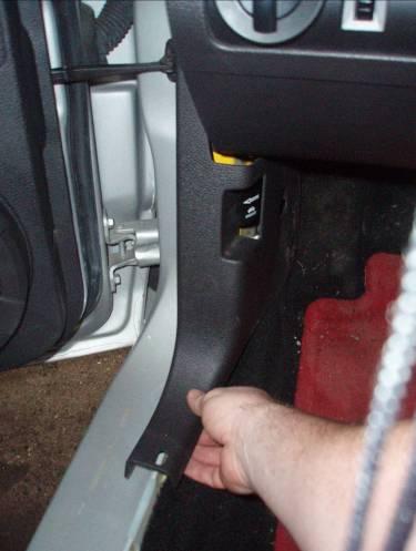 (Figure 10) STEP 14: Remove the driver side kick panel by grasping from the bottom