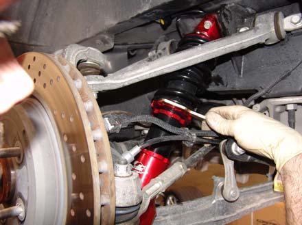 tight. Also make sure that all wires, and fluid lines are clear of the springs and shocks so that they are not pinched.