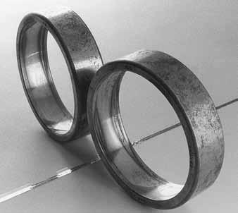 Figure 21 shows the condition that resulted when a cylindrical roller bearing outer ring was not fully supported, resulting in a surface initiated fatigue.