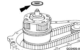 Remove the output shaft bearing and the speedometer tone wheel. 1. Remove the output shaft bearing. 2. Remove the speedometer tone wheel. 10. Remove the rear output shaft seal and the bearing. 1. Pry out the rear output shaft seal.