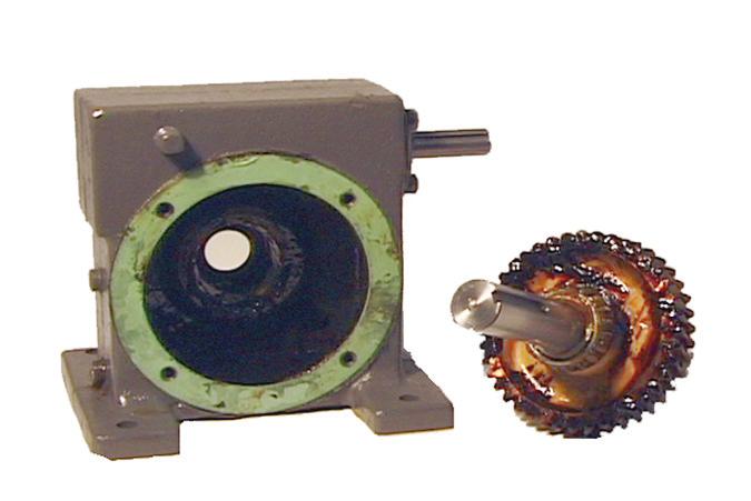 These components are described as follows: Driver Gear - The driver gear is a disk-shaped component with teeth which is attached to the shaft of the driver.