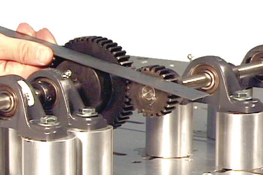 12. Check the gear alignment by placing a straight edge flush against the faces of the two gears, as shown in figure 42. The driver gear will be adjusted to align with the driven gear.