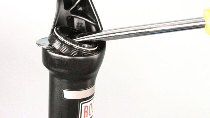 A screwdriver with a square shaft will damage the fork leg.