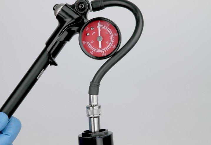9 Refer to your pre-service recorded settings to pressurize your air spring, or use the air chart on the fork's lower leg and pressurize the air spring to the appropriate pressure for your rider
