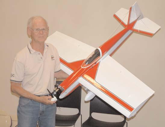 (Continued from the previous page) WALT WILSON PHOTOS Russ Watts discussed his BIY Somethin Extra built from a Sig kit. It has a Saito.56 four-stroke up front and flies very well.
