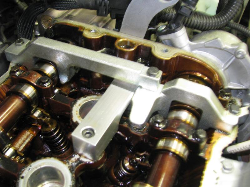 (The tensioner is located on the side of the engine block timing Step 8: Assemble the new timing chain rail cassette with cover facing the firewall.