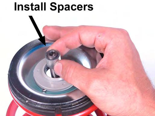 Ensure that the tapered spacers are properly seated against the shoulder of the spherical  23.