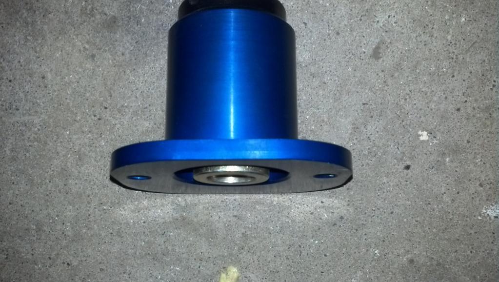 bottom of the strut mount and the top of the