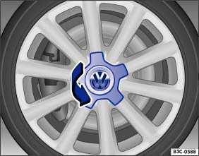Vehicles with pull-off hubcaps To remove Take the wire clip out of vehicle tool kit and hook it into one of the holes in the hubcap fig. 159.