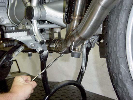 4. Correctly position and slide the Akrapovic link pipe onto the