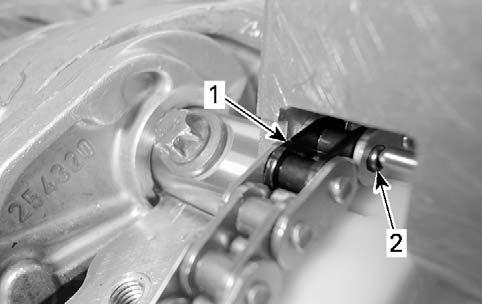 Push pin through, by turning the chain link remover handle until tight or pin bottoms out.