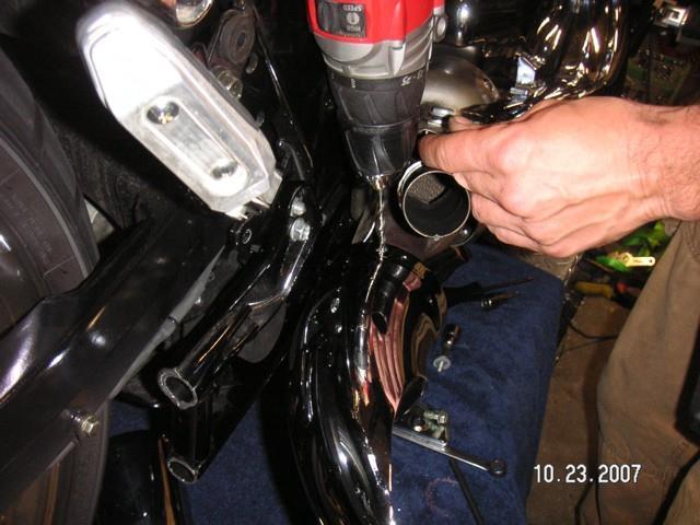 Remove the top tube heat shield and Scorpion tip to gain access to the lower assembly.