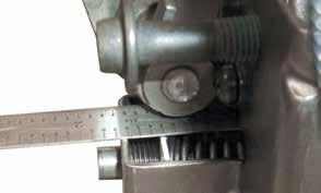 Install the adjusting screw bracket (Figure 18) on valve body, making sure Sonnax pressure regulator spring and switch valve spring are aligned correctly. e.