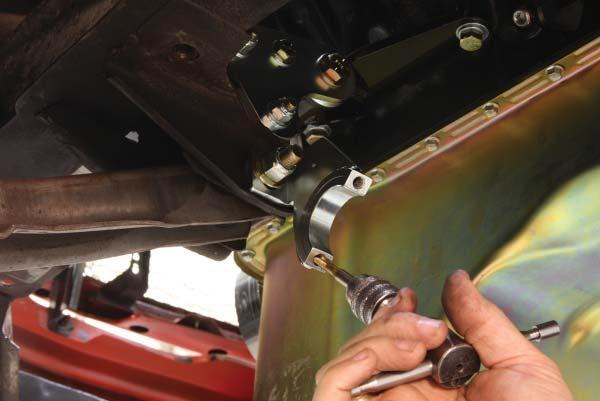 20. Bolt the lower rack brackets to the lower control arm mounts using the orientation and hardware shown on page two.