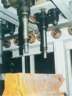 machines which are designed for removing sand from engine cylinder block castings.