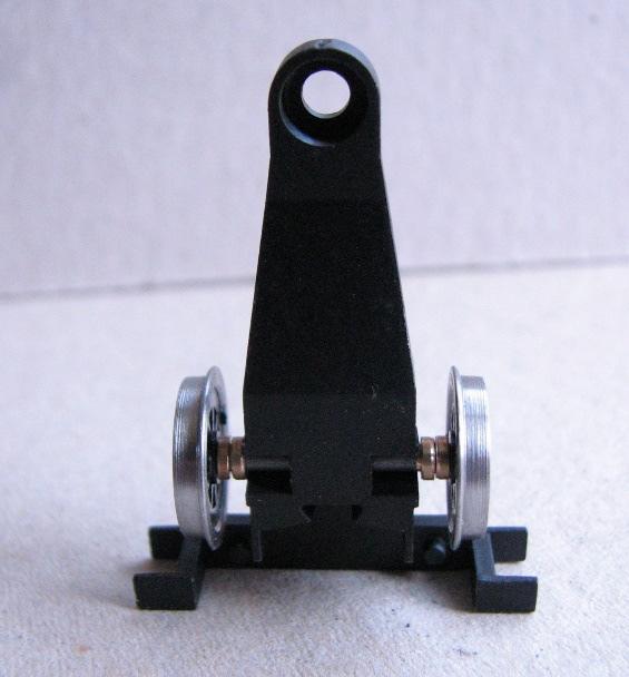 Simply twist and pull one Hornby wheel from its axle, and slide the remaining wheel and axle out the other side. 2.