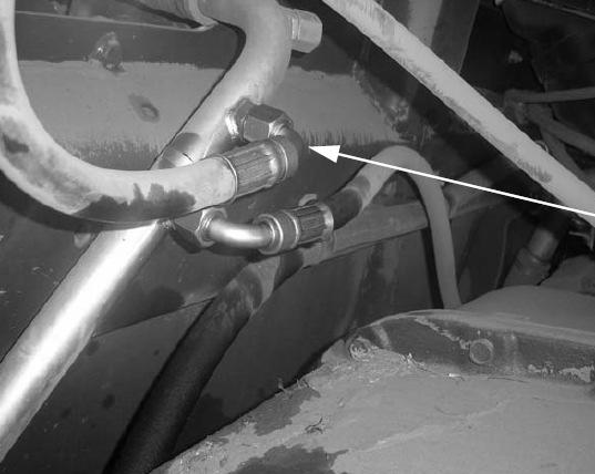 Connect the Tank Hose Connect the Tank Hose 1. Identify the Tank/Return line on the tractor. It is located under the cab on the left side just next to the oil reservoir.