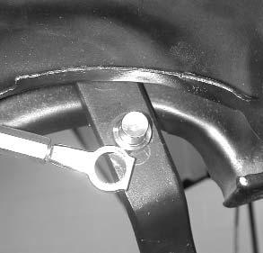 7. Position the booster pushrod onto the brake pedal using the provided bushing.
