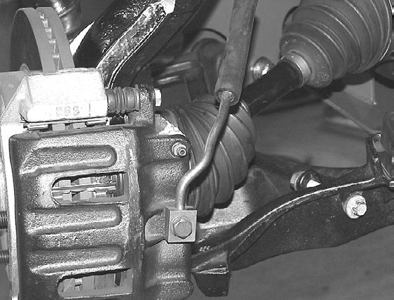 Route the ABS line to the front side of the steering knuckle and attach with provided Adel clamps with ¼ x 3.4 bolt and washer to the knuckle. Torque to 5LBS. SEE PHOTO BELOW.