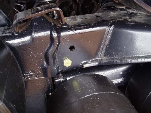 Keep the bolts in the cab in order to be able to replace them before the tracks are removed from