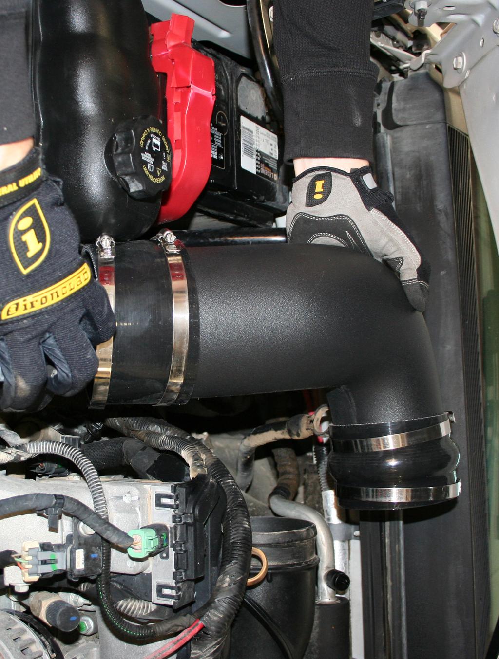 Connect the silicone couplers to the stage 2 air intake tube.