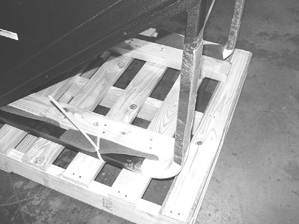 REMOVE STEPMILL FROM PALLET: SLIDE THE MACHINE FORWARD SO THAT THE FRONT EDGE OF THE MACHINE HANGS OFF THE FRONT OF THE PALLET.