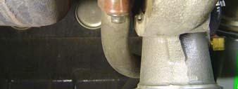 turbocharger (Fig. 8). Set the two bolts aside.
