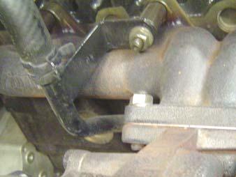Remove the two rear exhaust flange nuts located on the bottom of the turbocharger flange