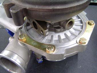 Remove the nut on the coolant tube bracket and pull the bracket off