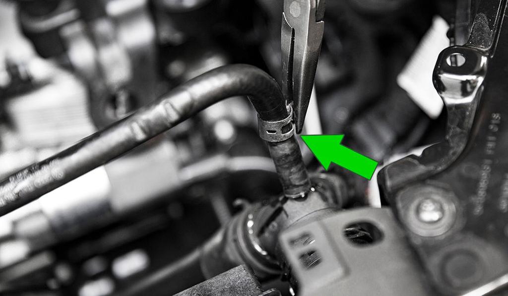 Using pliers, slide the coolant line hose clamps above the the coolant barbs on both ends, do