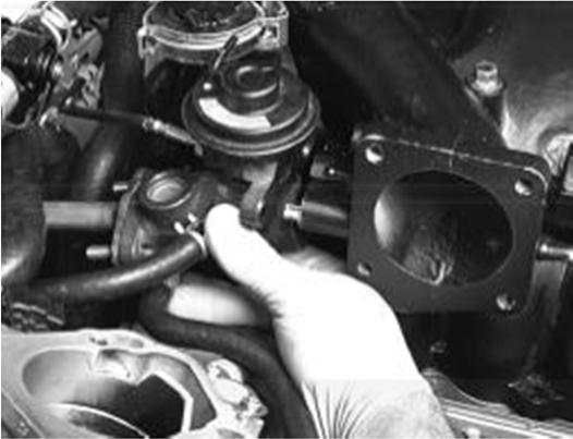 This will ease the removal and installation procedures (figure 42). 2. Loosen or remove the clamp holding the pipe to the back of the engine. 3.
