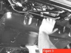 Loosen the alternator pivot bolt (top), pinch nut and adjusting bolt and remove the alternator belt.