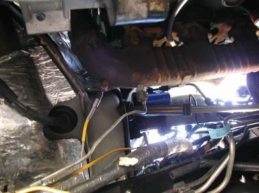 The photo below is taken viewing the truck from the ground up. The section of the exhaust manifold that requires tapping is located on the driver s side above the driveline.