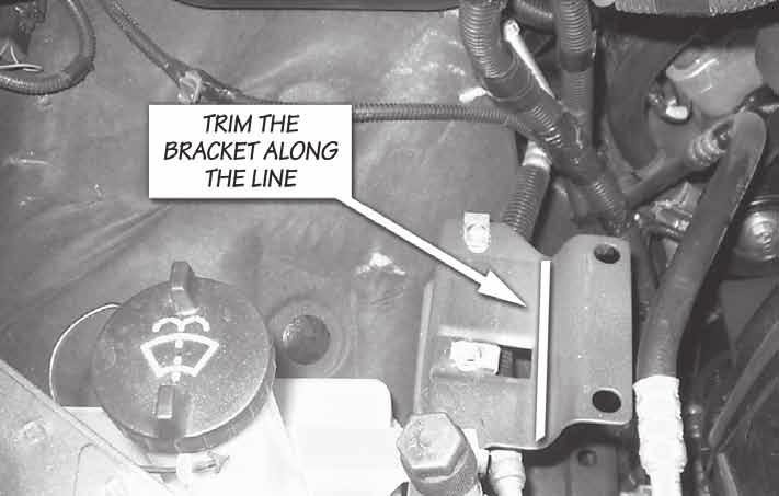 Section 3 Trim Brackets Figure 9 Figure 10 Figure 11 2003 to 2004 vehicles only (Steps 31 through 37) 31. Remove the passenger side battery hold down clamp [(1x) 8mm socket]. 32.
