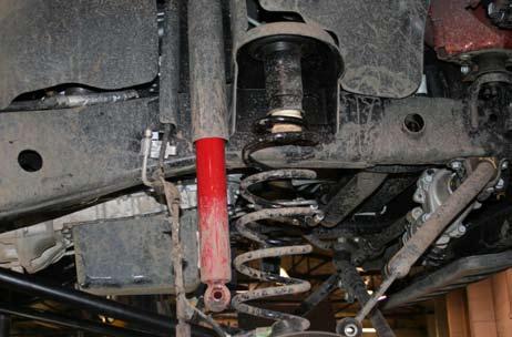 socket and wrench. 22. 23. Place jack under the axle and slightly lift the front axle so you can easily remove factory hardware form shocks, sway bar links.
