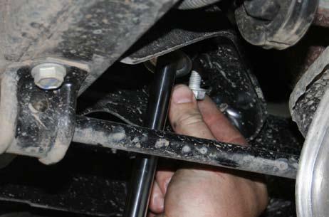Remove sway bar links using an 18mm socket and wrench, make sure to put aside for use in the front of